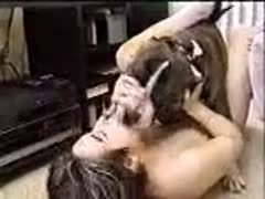 On the floor, a fuckable whore is making out with a dog.